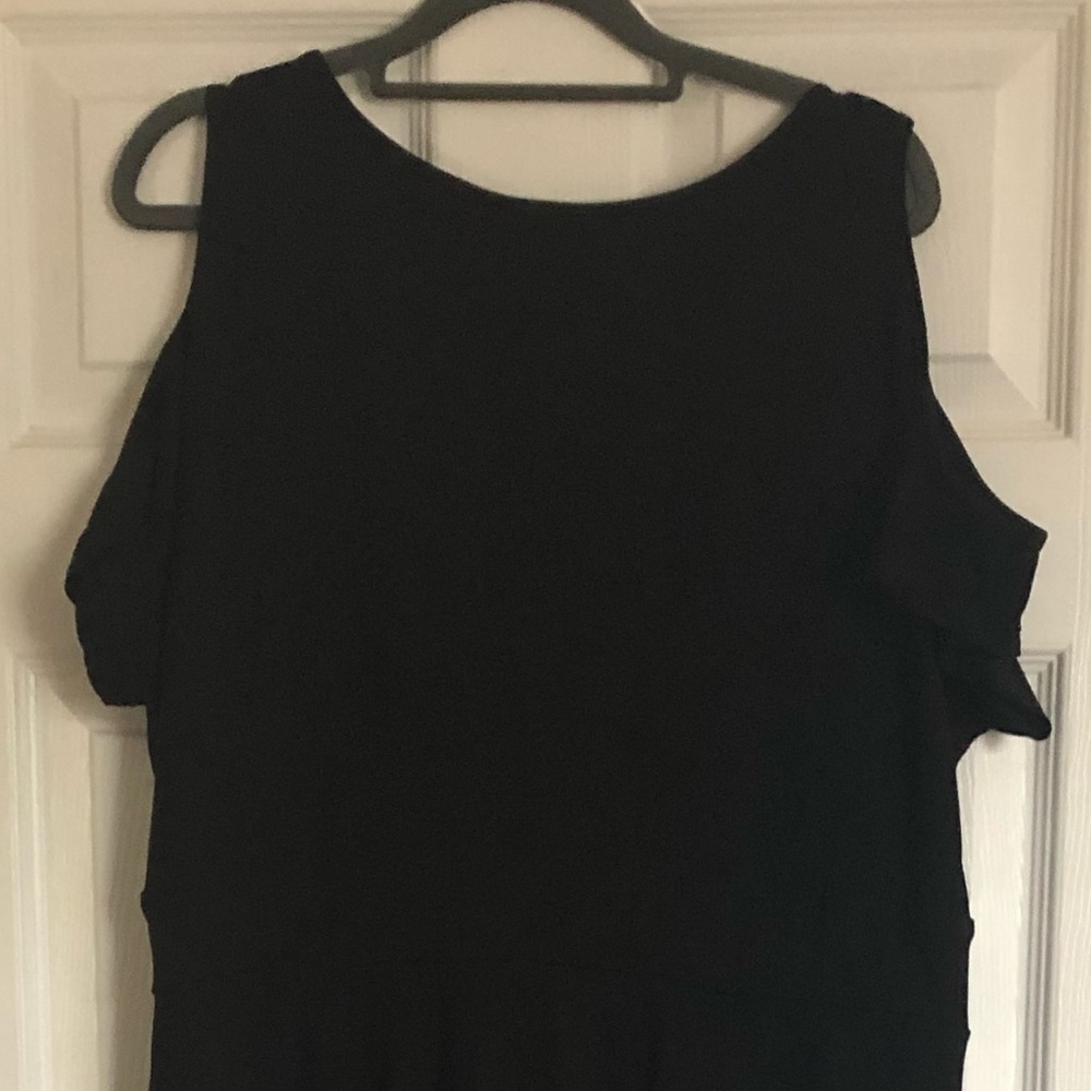 Black maxi dress with open shoulder sleeve. Long